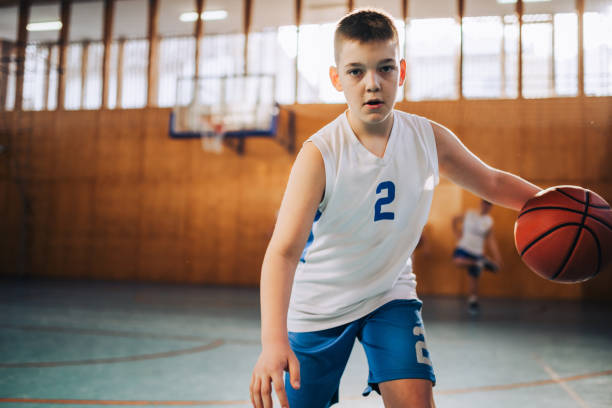 istock Youth basketball player with intense focus 2158915295