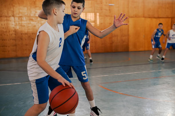 istock Kids engaging in basketball defense 2158915298