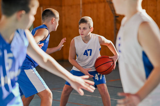 istock Focused kid basketball player with the ball 2158915299
