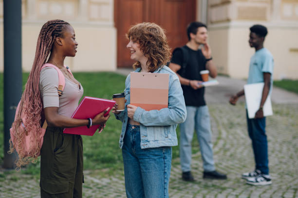 istock Diverse college students discussing at college campus on a coffee break 2158915300