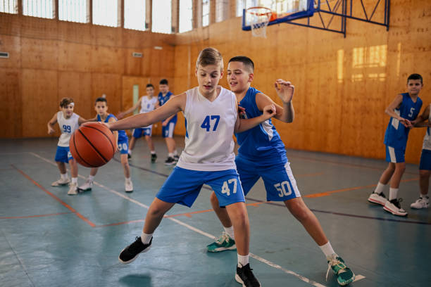 istock Basketball practice with two energetic young kids 2158915306