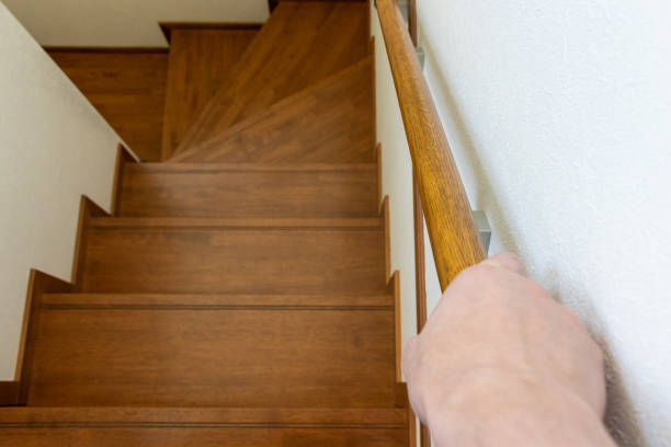 istock Descend the stairs while holding the handrail 2158921127