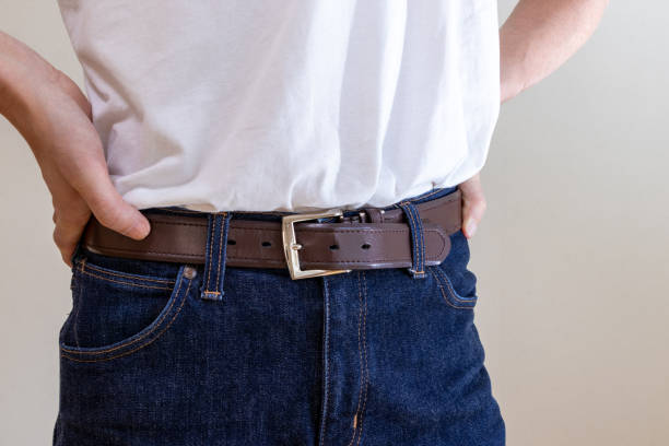 istock A man's waist tightened with a belt 2158922111