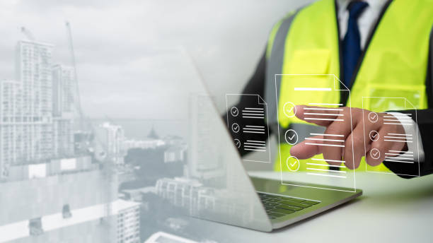 istock Engineer or Architect checking the list of documents and approving the project, Approved buildings permit concept with approved residential building project, Construction project inspection. 2158922631