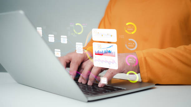 istock Business people use computers to analyze business and manage corporate data, business analytics with charts, metrics and KPIs to improve organizational performance, marketing, financial organization strategy. 2158922632