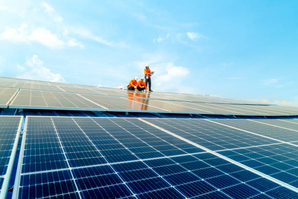 istock engineer man inspects construction of solar cell panel or photovoltaic cell by electronic device. Industrial Renewable energy of green power. factory worker working on tower roof. 2158922762