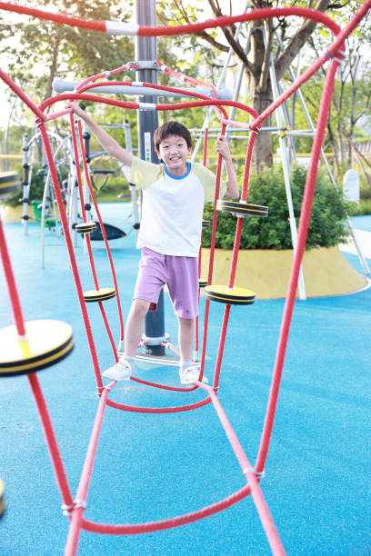 istock Little boy walking on a balance beam 2158923216