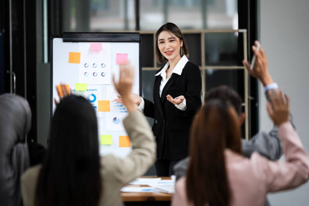 istock Successful multiethnic business people presenting analytical report while working and meeting together in office 2158925083