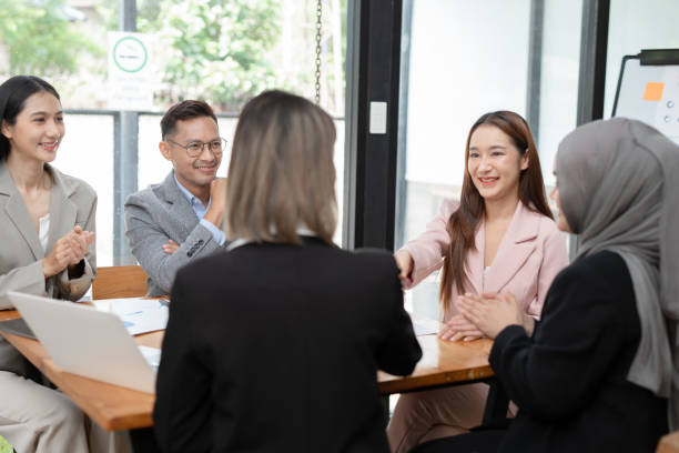istock Asian Business Group Chat about graph work Present in meetings, in the office 2158926059