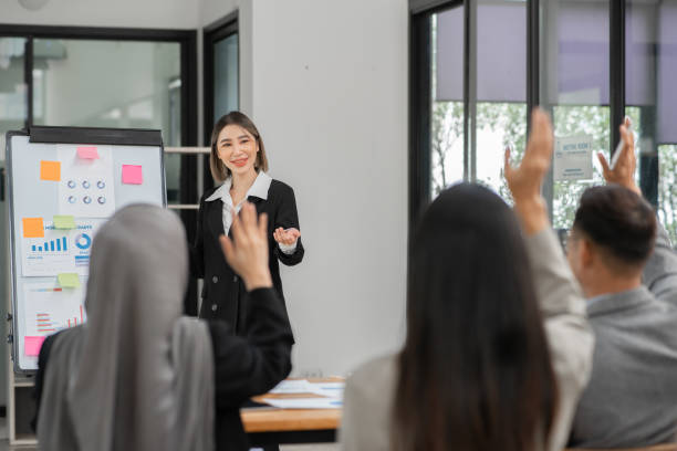 istock Asian Business Group Chat about graph work Present in meetings, in the office 2158926088