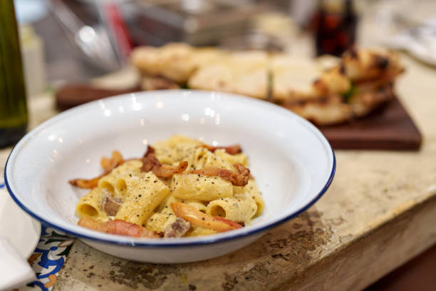 istock Creamy pasta rigatoni with pork guanciale and cheese 2158927426