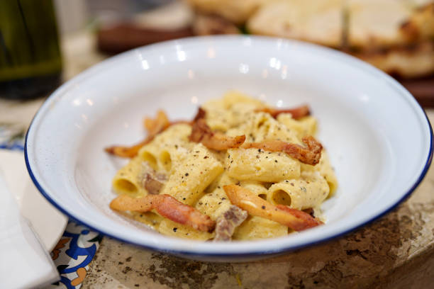 istock Creamy pasta rigatoni with pork guanciale and cheese 2158927488