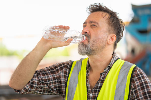 istock Engineer man drinking water at the precast factory site, Worker man drinking water at construction site 2158928753