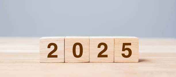 istock wooden cube block with 2025 text on table background. Resolution, plan, review, goal, start and New Year holiday concepts 2158932623