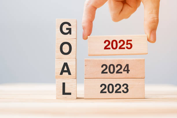 istock hand pulling 2024 block over 2024 and 2025 wooden building on table background. Business planning, Risk Management, Resolution, strategy, solution, goal, New Year New You and happy holiday concepts 2158932624