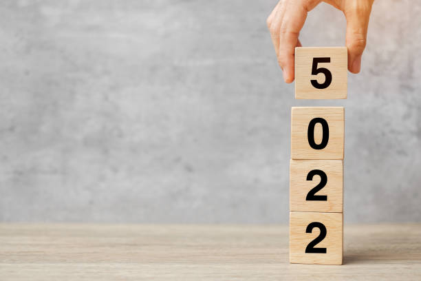 istock hand holding block 2025 text on table. Resolution, strategy, plan, goal, motivation, reboot, business and New Year holiday concepts 2158932646