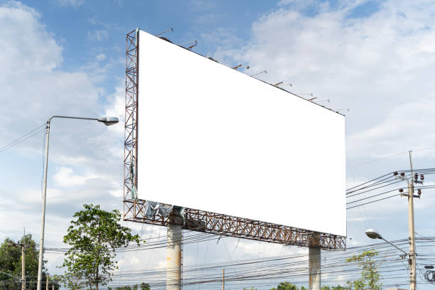 istock Blank billboard on blue sky background for new advertisement in a city. which is just below the level of the wires. 2158933030