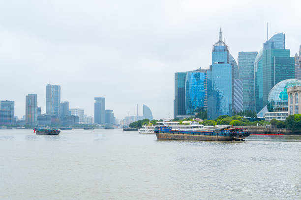 view of shanghai skyline at dawn, river and bridge