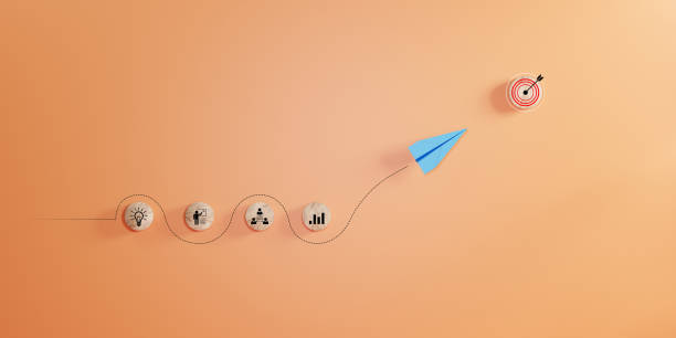 istock Leadership concept with blue paper plane leading among white on orage background. 2158935804
