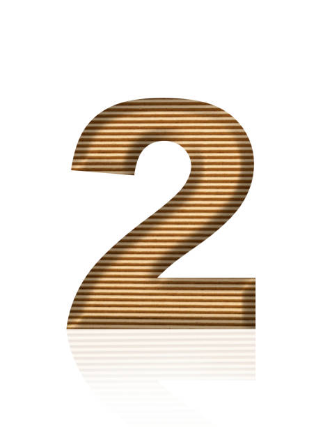 Close-up of three-dimensional cardboard number 2 on white background.