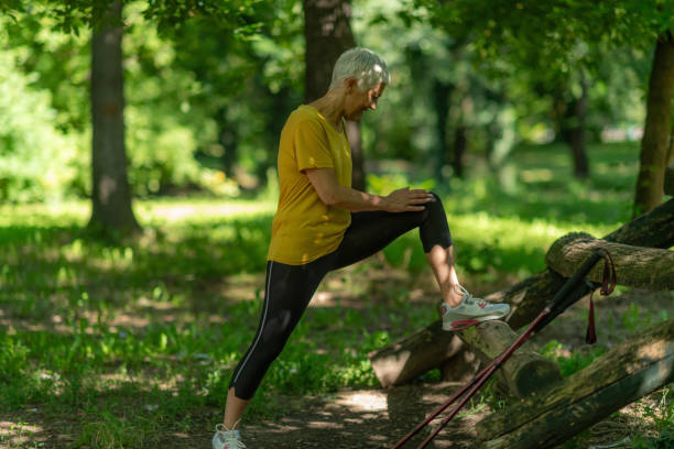 istock Active senior woman stretching after training session in the park. 2158939086