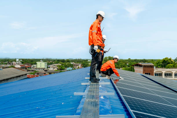 istock engineer man inspects construction of solar cell panel or photovoltaic cell by electronic device. Industrial Renewable energy of green power. factory worker working on tower roof. 2158939171