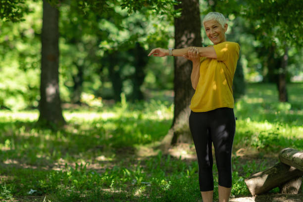 istock Active senior woman stretching outdoors after workout session. 2158939270