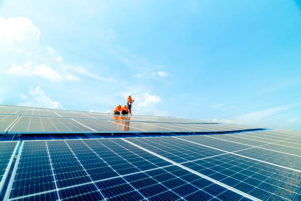 istock engineer man inspects construction of solar cell panel or photovoltaic cell by electronic device. Industrial Renewable energy of green power. factory worker working on tower roof. 2158939379