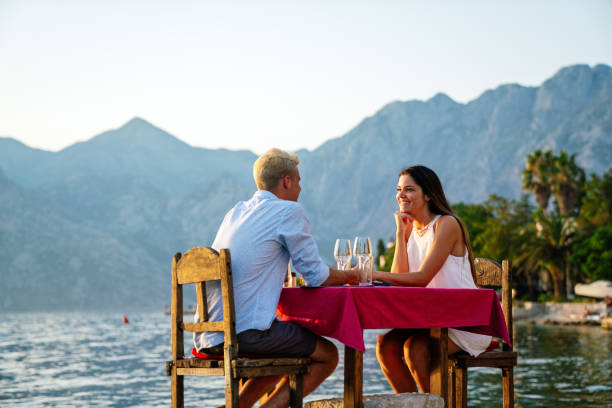 istock Couple is having a private event dinner on a tropical beach during sunset time 2158940219