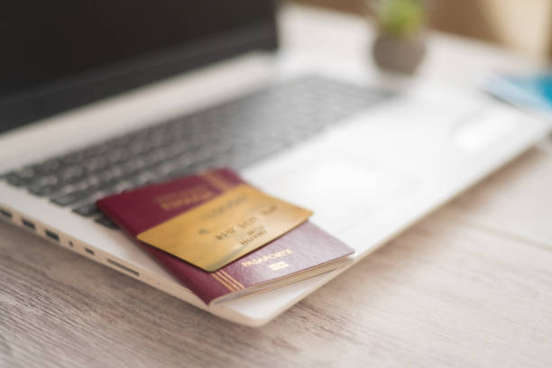istock Laptop with Passport and Credit Card. 2158940434