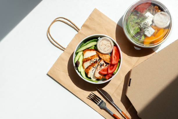 istock Take out poke bowl with craft bag on white background 2158943577