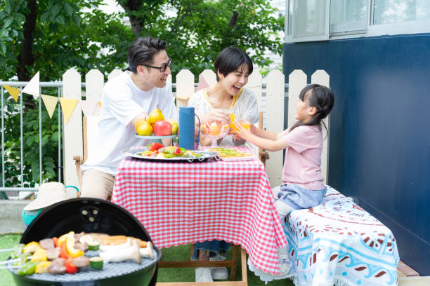 istock family enjoying barbecue 2158944018