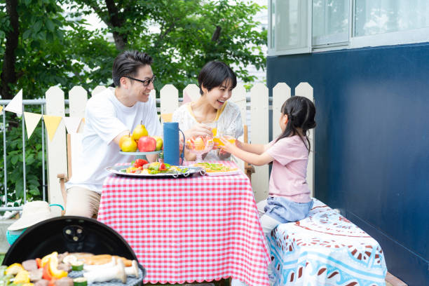 istock family enjoying barbecue 2158944021