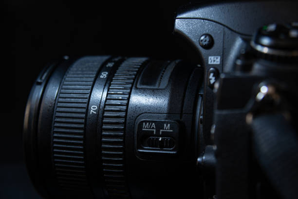 istock Black Digital Camera Lens and DSLR Camera Close Up On Dark Background 2158944408