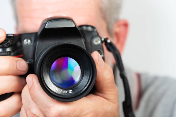 istock Close Up of a Persons Hands Holding a Digital Camera 2158944456