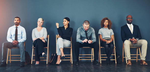 istock Business people, recruitment and waiting in row for interview with hiring process and employment opportunity. Diverse group, job seeker and nervous in line for HR meeting with mockup space and banner 2158944609