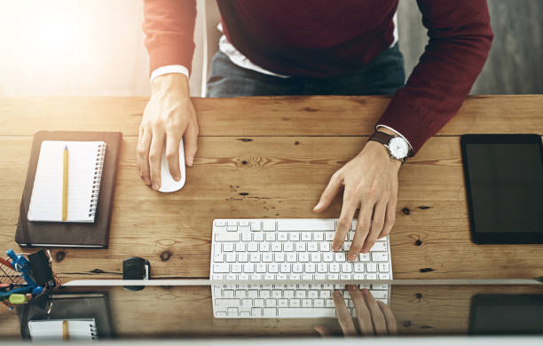 istock Man, web designer or hands on computer in top view for online research, productivity or technical solution. Above, creative and employee typing on technology or keyboard for internet or system update 2158944869