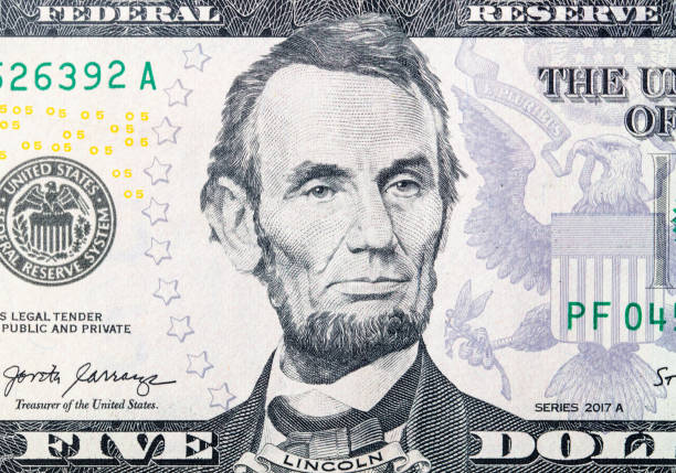 istock Details of a five dollar bill. Background 2158944960