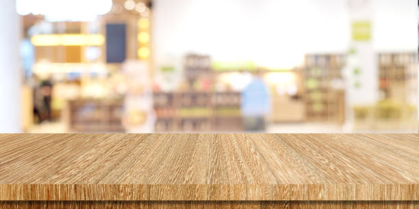 istock Wood table background and blur background, Empty wooden counter, shelf surface over blur restaurant with bokeh background, Wood table top for retail shop, store product display backdrop, banner, mock up, template 2158947520