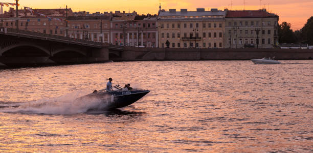 Saint-Petersburg, Russia - July 27, 2019: Fast pleasure motor boat sails the Neva river in the evening