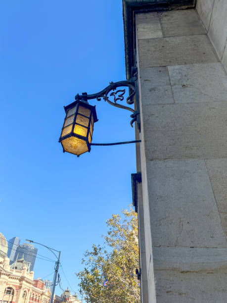 istock Illuminated lamp on street wall 2158950549