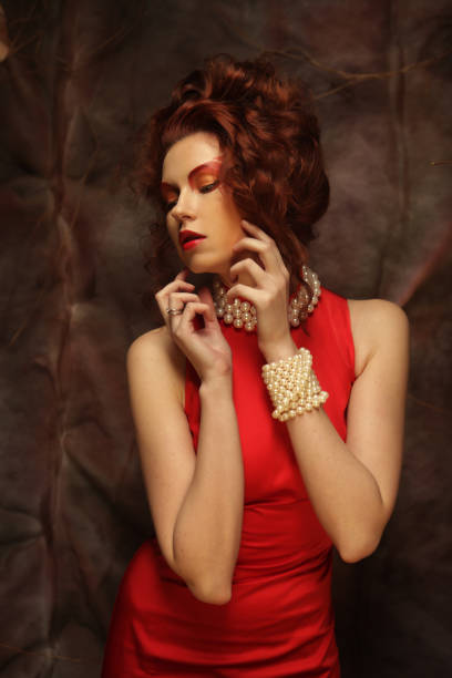 istock young woman in red dress 2158951248