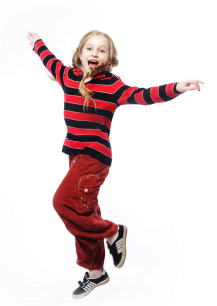 istock girl jumps on a white background 2158952064