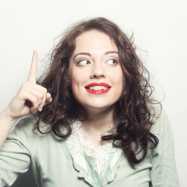 istock beautiful and surprised young woma 2158952566