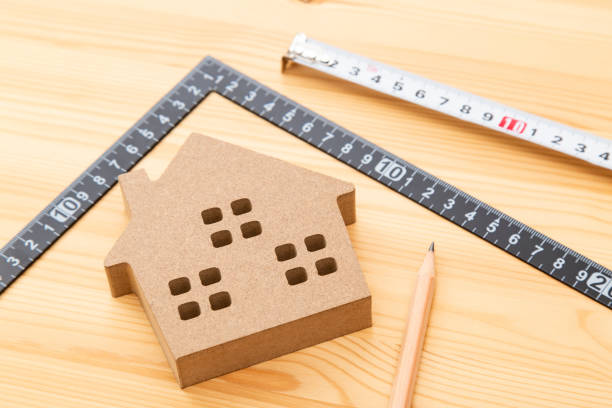 istock A square and a house object on a wood grain background 2158954357