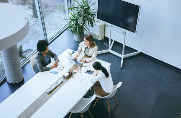 istock Team members discussing project at a meeting 2158956318