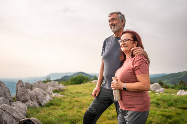 istock Elderly Couple Enjoying Scenic View on Nature Trek 2158956655