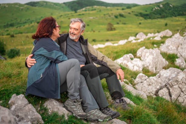 istock Senior Couple Enjoying Restful Moment on Nature Hike 2158956677