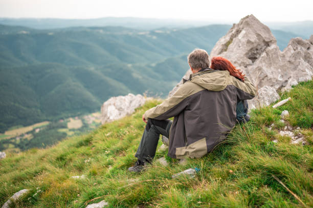 istock Senior Couple Resting During Mountain Hike 2158956692