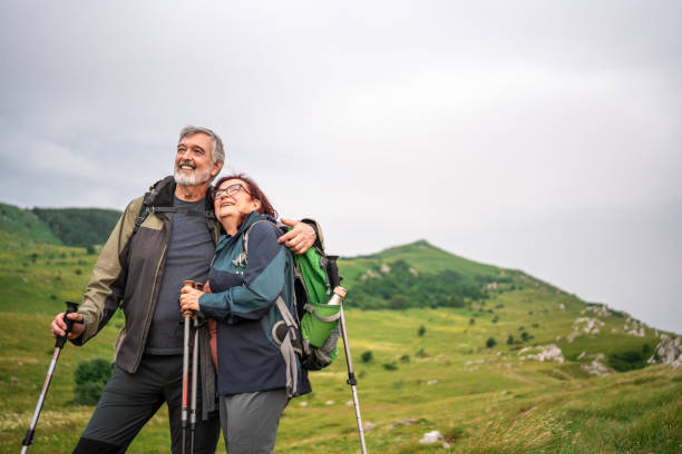 istock Senior Couple Enjoys Mountain Trekking Together 2158956725
